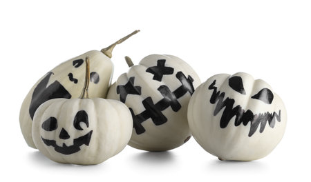 Halloween pumpkins with drawn face on white backgroundの写真素材