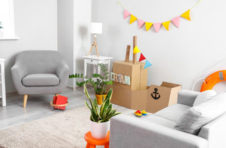 Interior of children's room with toy cardboard ship