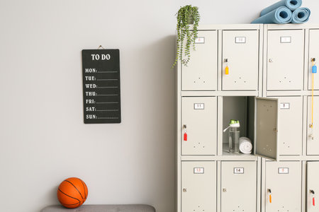 Locker with sport equipment in change-room