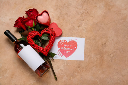 Composition with bottle of wine, roses and card for Valentine's Day on color backgroundの写真素材