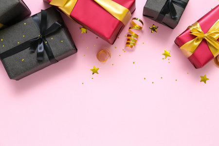 Gift boxes with confetti on pink background. black friday sale