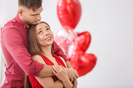 Happy couple spending time together at home. Valentine's Day celebrationの写真素材