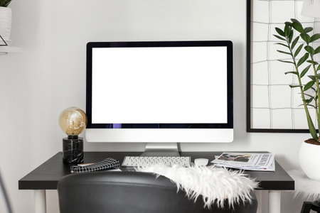 Workplace with modern computer in stylish room interior