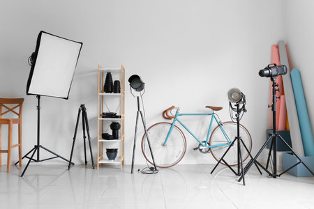 Lighting equipment and bicycle in modern photo studioの写真素材