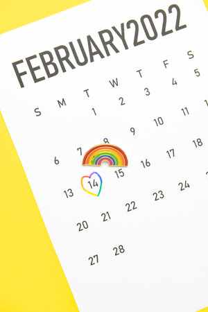 Calendar with marked date of Valentines Day on color background. LGBT conceptの写真素材
