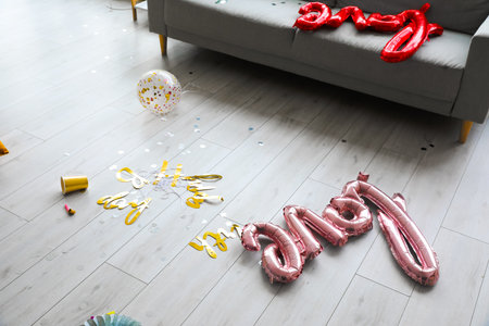 Decor on floor in messy room after partyの写真素材