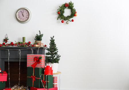 Stylish decorated fireplace for Christmas celebration in living roomの写真素材