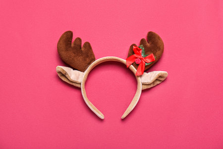 Christmas reindeer horns on red backgroundの写真素材