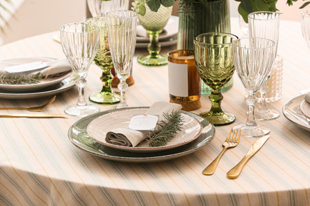 Stylish table setting with wedding invitation