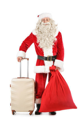 Santa Claus with bag and suitcase on white backgroundの写真素材
