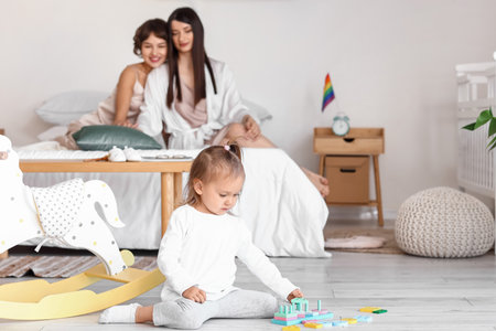 Little girl playing with toys in the bedroomの写真素材