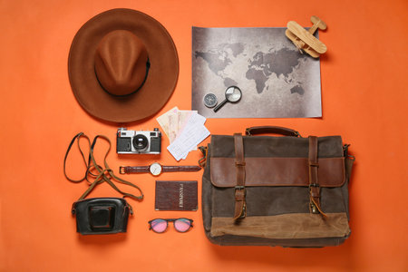 Traveling belongings with world map on color backgroundの写真素材