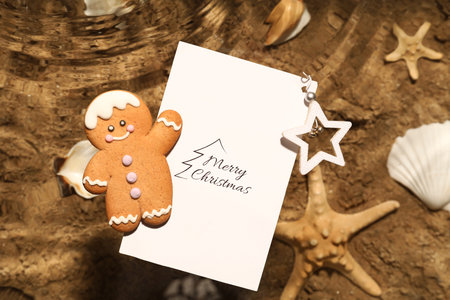 Christmas cookie with greeting card floating on water at sea resort