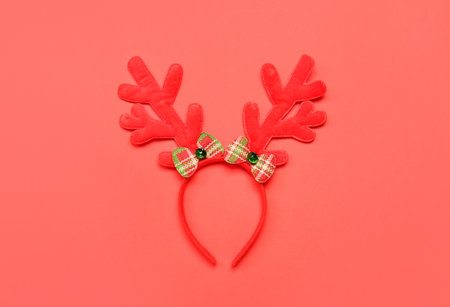 Christmas reindeer horns on red backgroundの写真素材
