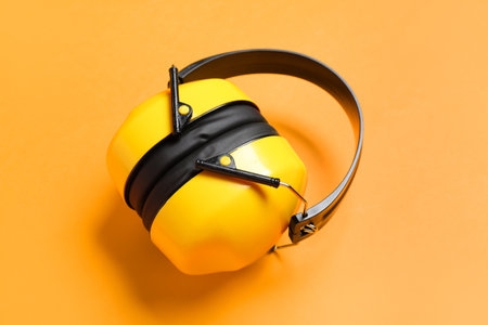 Hearing protectors on color backgroundの写真素材