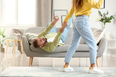 Young woman rejecting marriage proposal at homeの写真素材