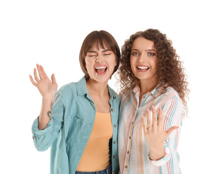 Happy engaged lesbian couple on white backgroundの写真素材