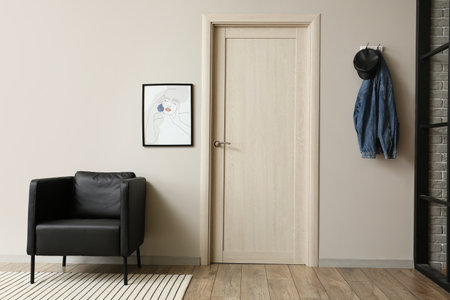 Interior of room with armchair near doorの写真素材