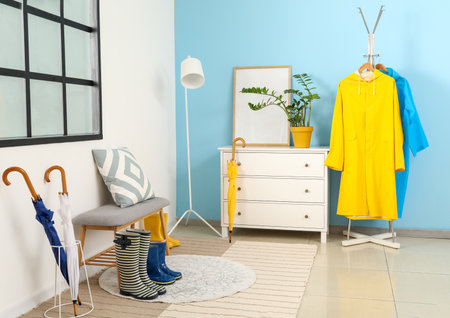 Raincoat in interior of modern hallwayの写真素材