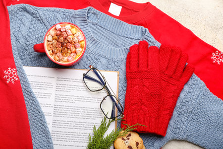 Clothes, book, eyeglasses and cup of cacao, closeup. hello winterの写真素材