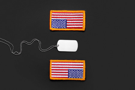 Chevrons of USA army and military tag on dark backgroundの写真素材