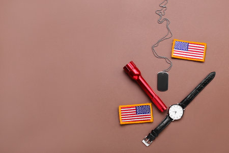 Chevrons of USA army, military tag, wristwatch and flashlight on color backgroundの写真素材