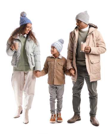 African-American family in winter clothes and with tasty hot chocolate on white backgroundの写真素材
