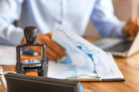 Stamp on table of businessman in officeの写真素材