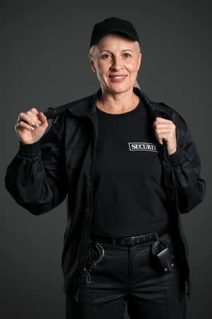 Female security guard on dark backgroundの写真素材