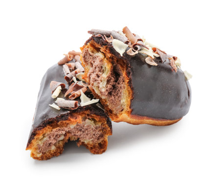 Broken chocolate eclair on white background