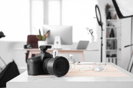 Professional photo camera on table in modern studio, closeupの写真素材