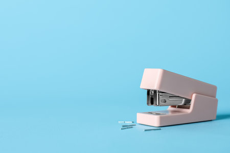 Stapler with staples on color backgroundの写真素材