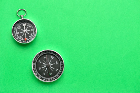 old compasses on green backgroundの写真素材