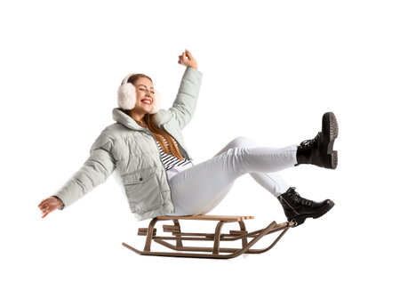 Young sledding woman on white backgroundの写真素材