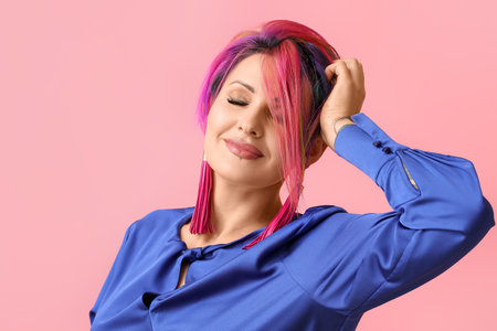 Beautiful woman with unusual hair on color backgroundの写真素材