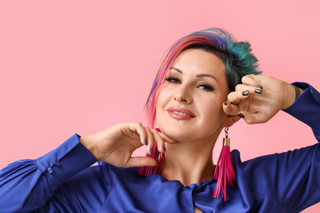 Beautiful woman with unusual hair on color backgroundの写真素材