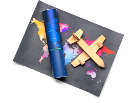 World maps and wooden airplane isolated on white background