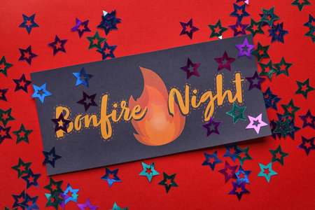 Greeting card for Guy Fawkes night on red background
