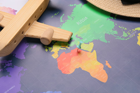 Wooden plane and red pin on map, closeupの写真素材