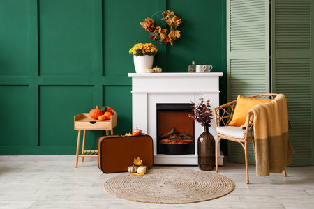 Interior of stylish room with modern fireplace, armchair and tableの写真素材