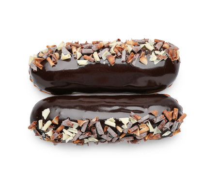 Sweet chocolate eclairs on white background
