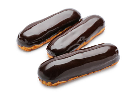 Tasty eclairs in chocolate glaze on white backgroundの写真素材