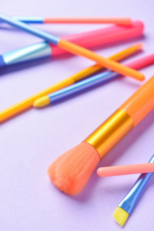 Set of different professional makeup brushes on color background, closeupの写真素材