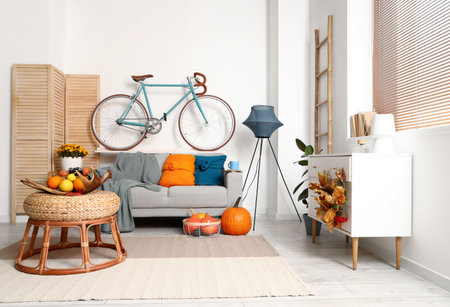 Interior of beautiful living room with autumn decorの写真素材