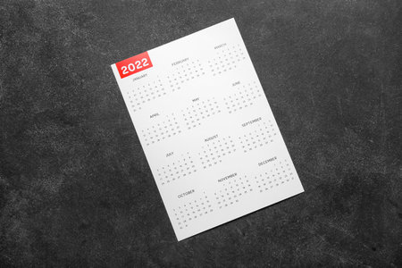 Paper calendar for year 2022 on dark background