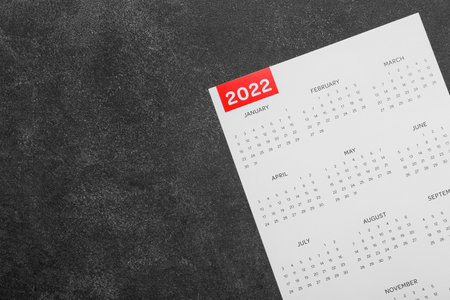 Paper calendar for year 2022 on dark backgroundの写真素材