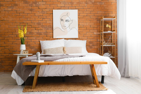 Vase with beautiful gladiolus flowers on the table in the bedroomの写真素材