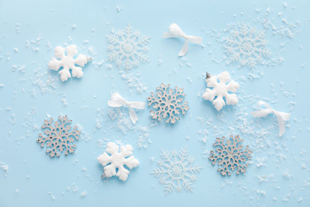 Composition with beautiful Christmas decorations and snow on color backgroundの写真素材