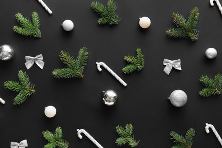 Composition with fir branches and Christmas decorations on dark backgroundの写真素材