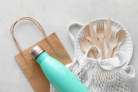 Different bags, Eco tableware and bottle on white backgroundの写真素材